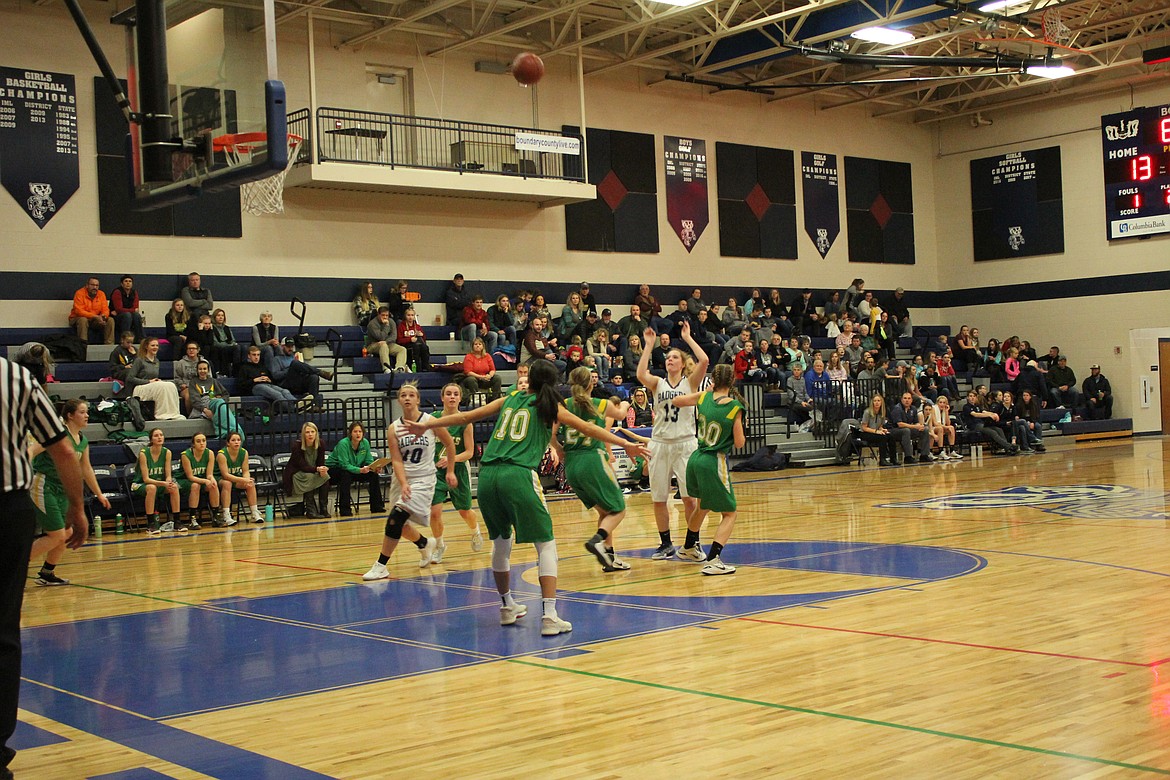 Photos by Tanna Yeoumans
Miranda Wenk launches a shot over the Lakeland defense during the Badgers&#146; 46-32 home win on Dec. 22. Wenk led all scorers with 20 points in the contest.