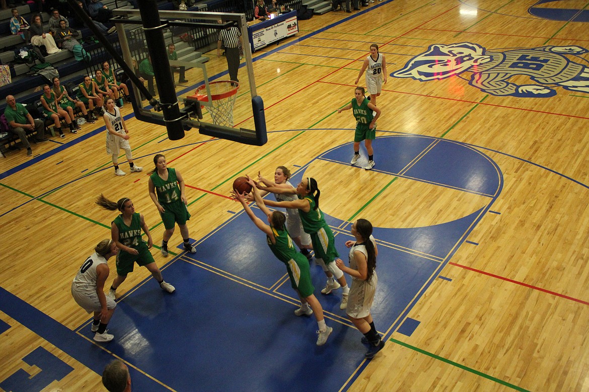 The BFHS girls fight for a rebound with Lakeland players during the Badgers&#146; win over the Hawks.