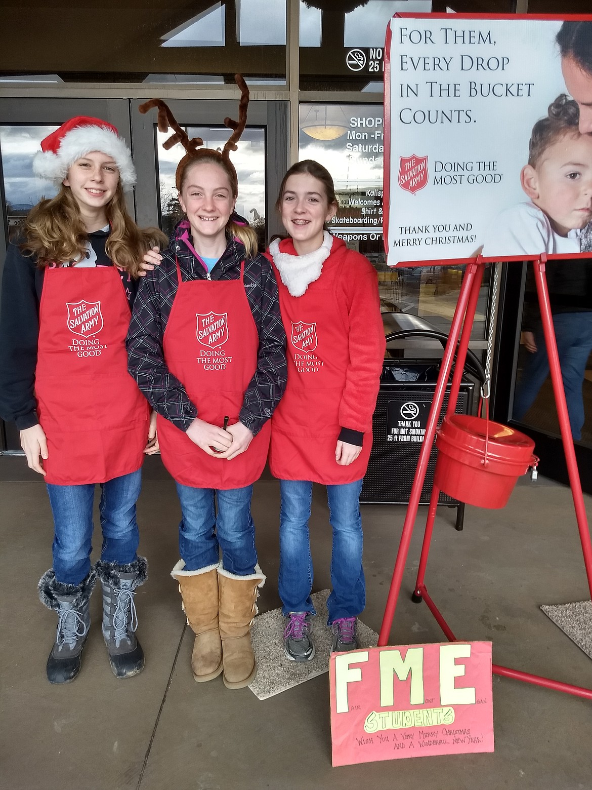 Fair-Mont-Egan eighth graders Grayce Siderius, Kya Wood and Ashlyn LeClercq raise money for the Salvation Army. This is the last year students participated in the community service activity as a class. Next year, they move on to high school. (Photos courtesy of Kristin LeClercq)