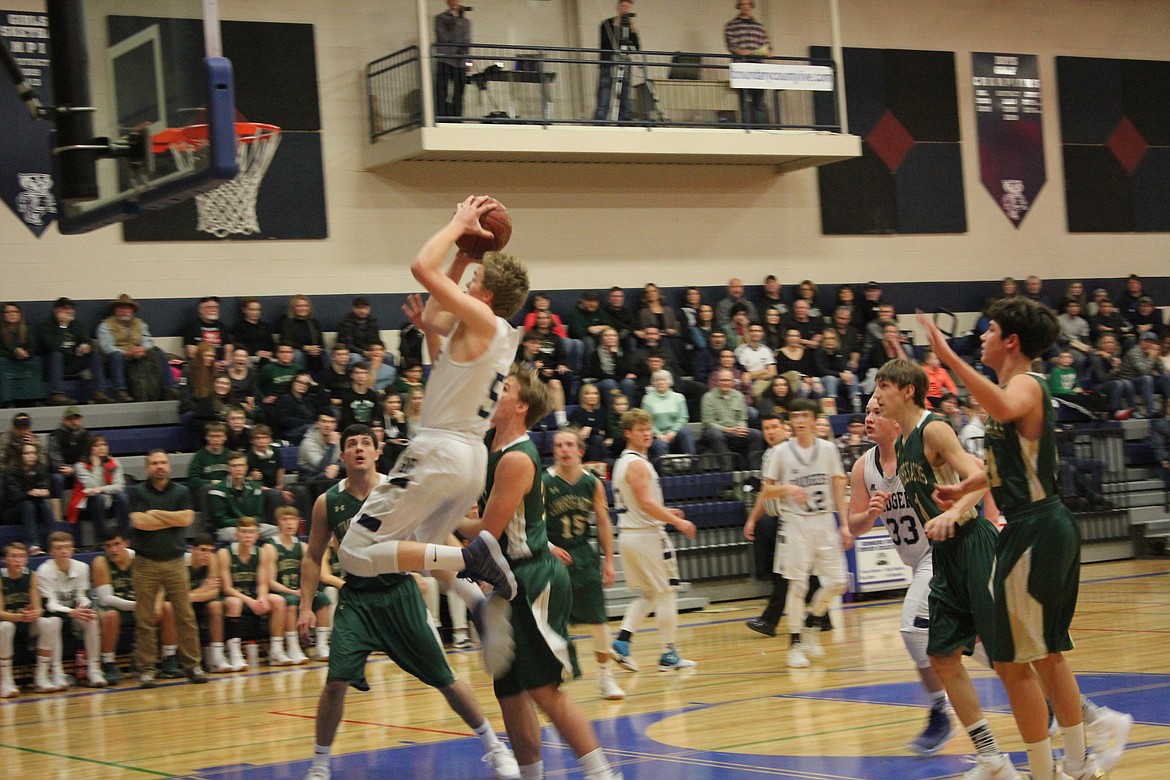 Photo by Tanna Yeoumans
Seth Bateman jumps high to achieve the goal.