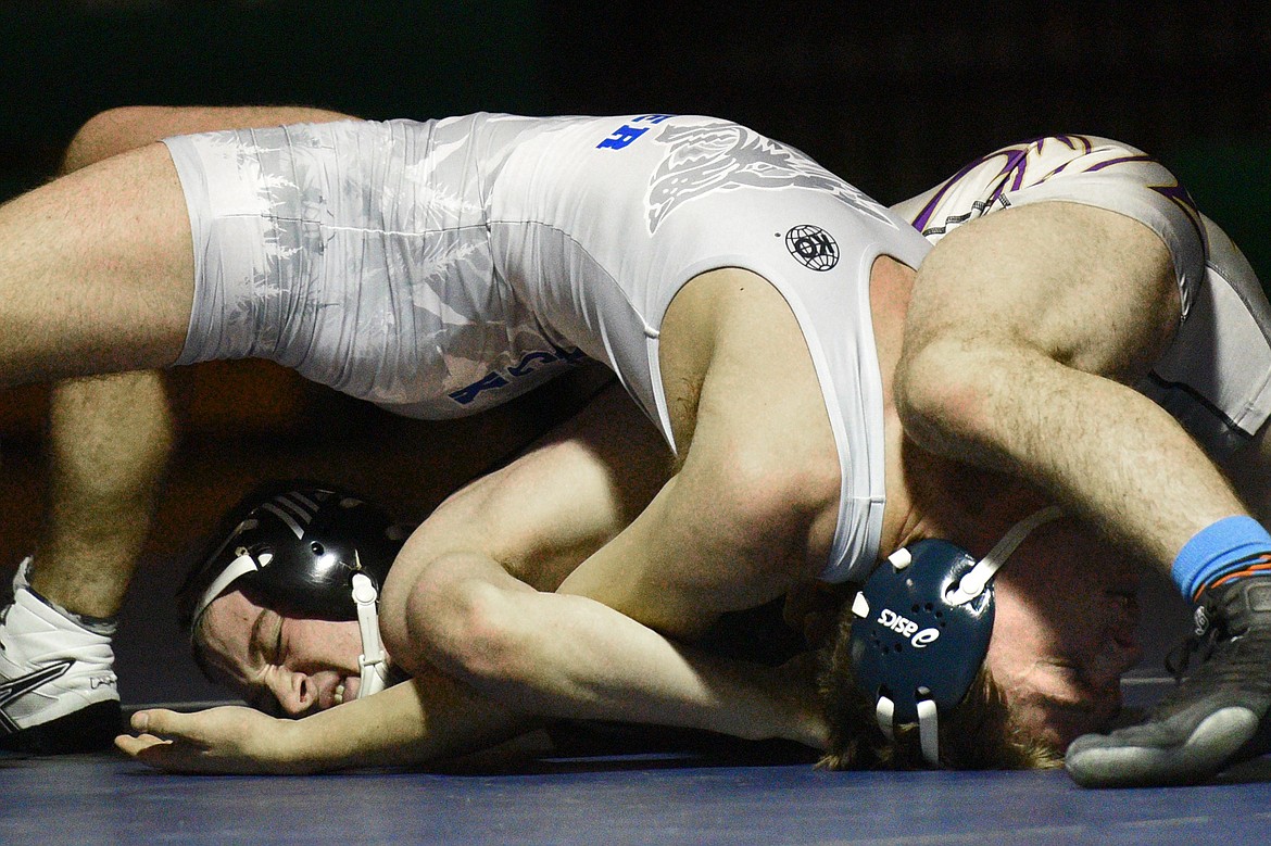 Glacier&#146;s Connor DeReu, top, wrestles Missoula Sentinel&#146;s Tanner Stack at 205 lbs. Stack won by pin. (Casey Kreider/Daily Inter Lake)