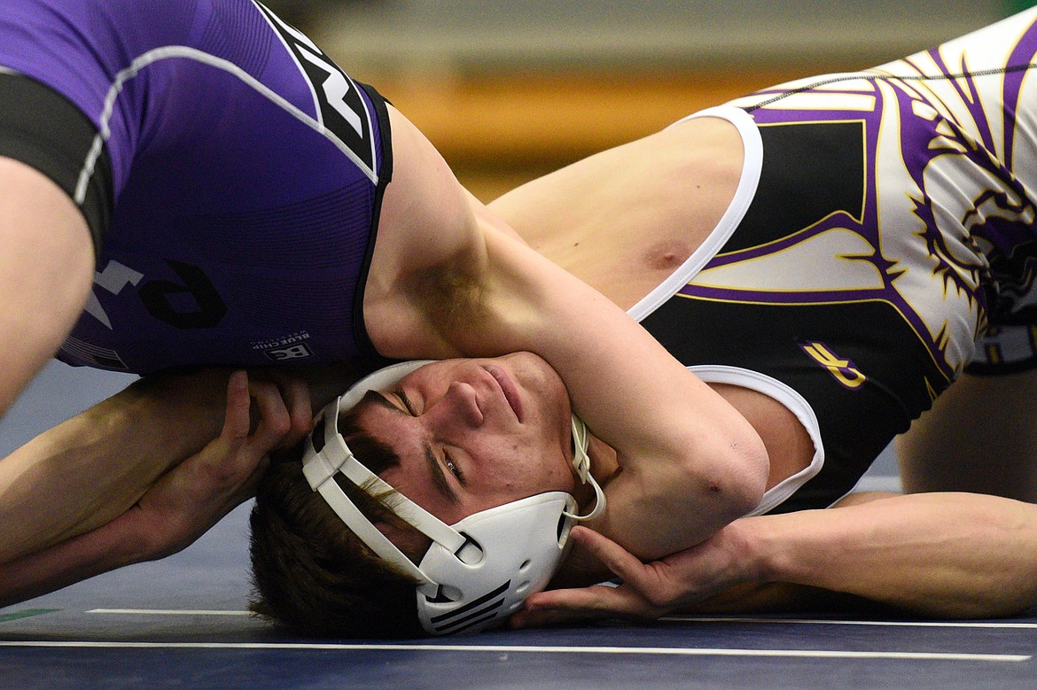 Polson&#146;s Bridger Wenzel, left, works for a pin against Missoula Sentinel&#146;s Justin Traver at 132 lbs. (Casey Kreider/Daily Inter Lake)