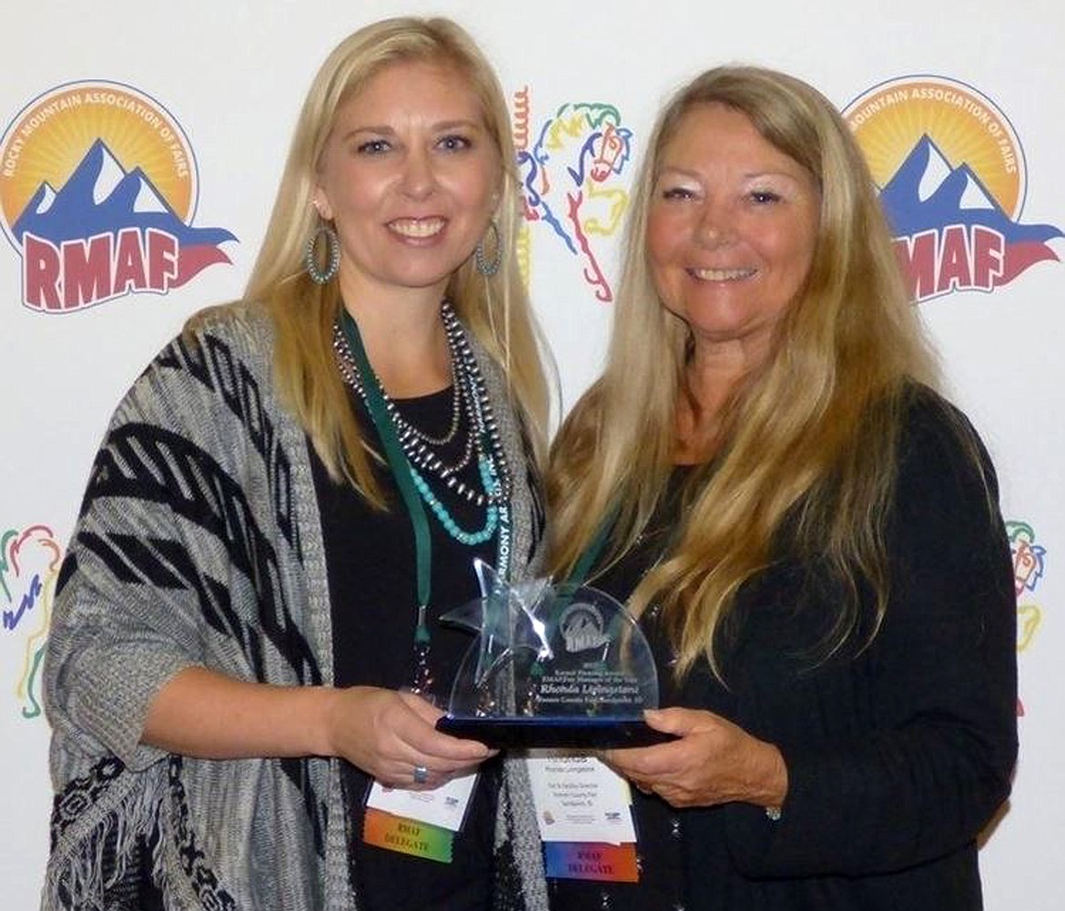 (Photo courtesy REED WILLIAMS)
Rhonda Livingstone, right, accepts the Fair Manager of the Year Award from her daughter, Alexcia Jordan, fair manager of the North Idaho State Fair.