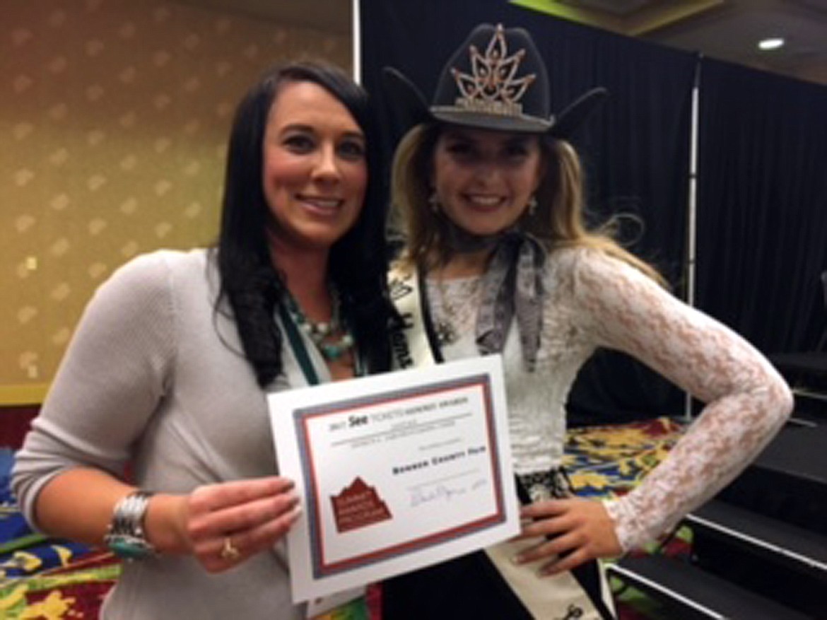 (Photo courtesy RHONDA LIVINGSTONE)
Sheena Feidler, left, accepts the Summit Award for the Bonner County Fair from Miss Teen Rodeo Colorado Springs.