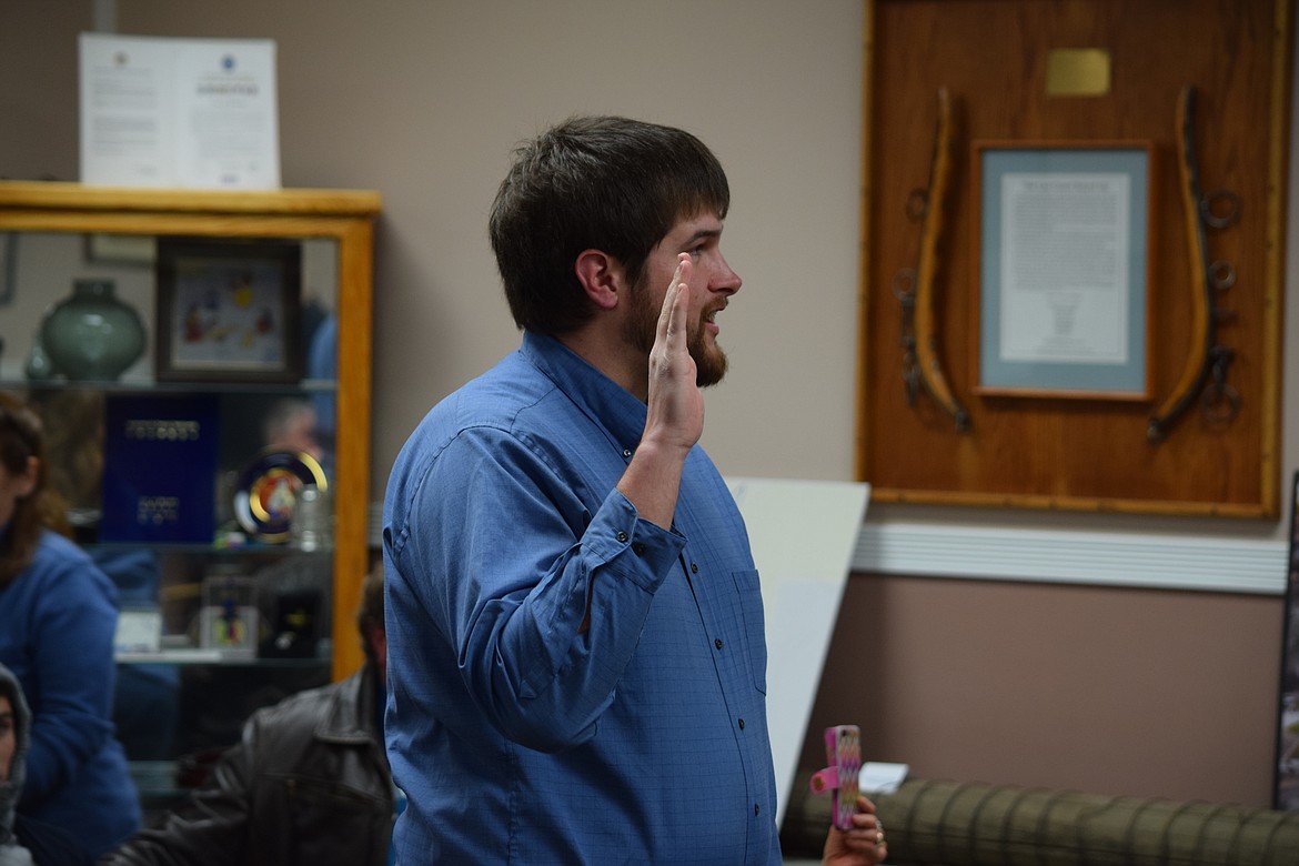 Charles H. Featherstone/Columbia Basin Herald
Justin Kooy repeats the oath of office to take his place on the Ephrata City Council on Wednesday. Kooy ran unopposed in November for the seat being vacated by Stephanie Knitter.