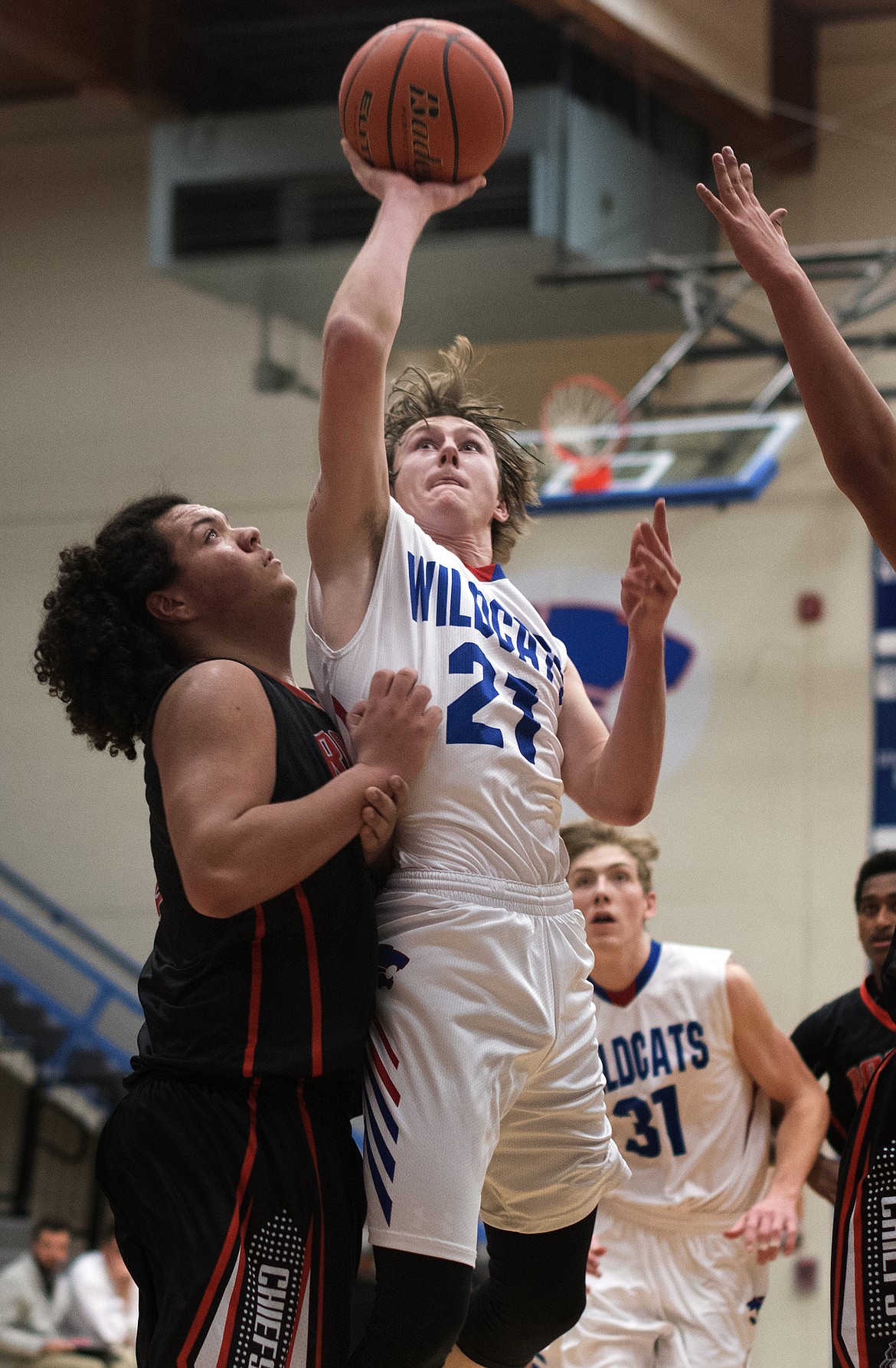 Quintin Shriver goes up for a tough two over Ronan&#146;s Anthony Camel Friday. (Jeremy Weber photo)