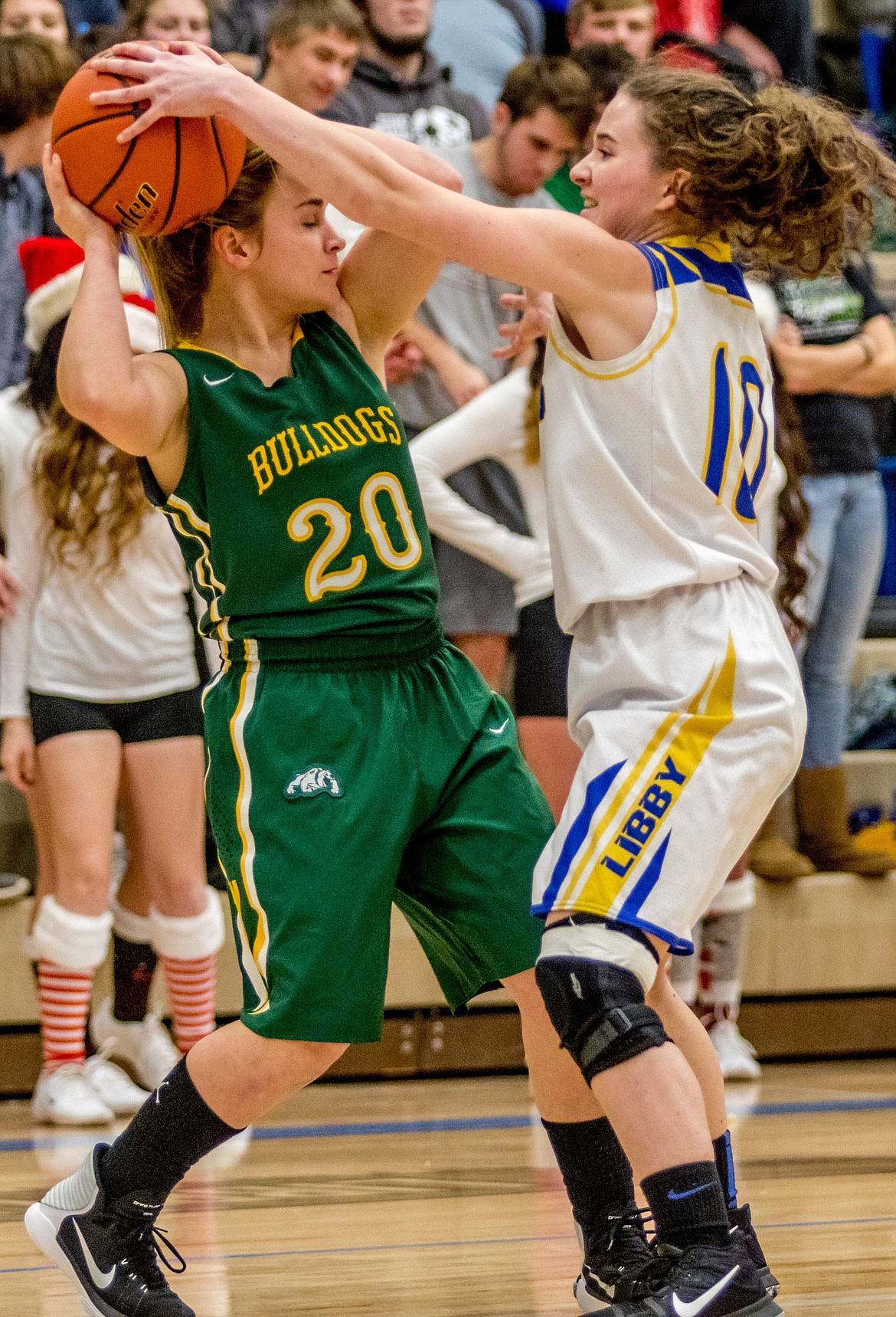 Libby's Emma Gruber disrupts Ashton Ramsey of Whitefish in Thursday's game in Libby. (John Blodgett/The Western News)