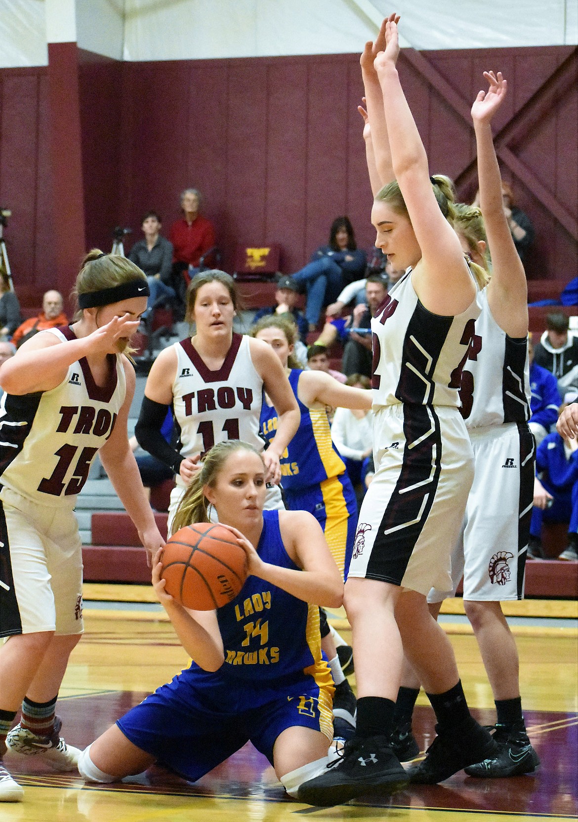 Troy's Kaitlyn Downey, left, Allie Coldwell, Grace Dolan and Katelynn Tallmadge surround Belle Cooper of Thompson Falls on Thursday. (Photo by Svetlana Harper)