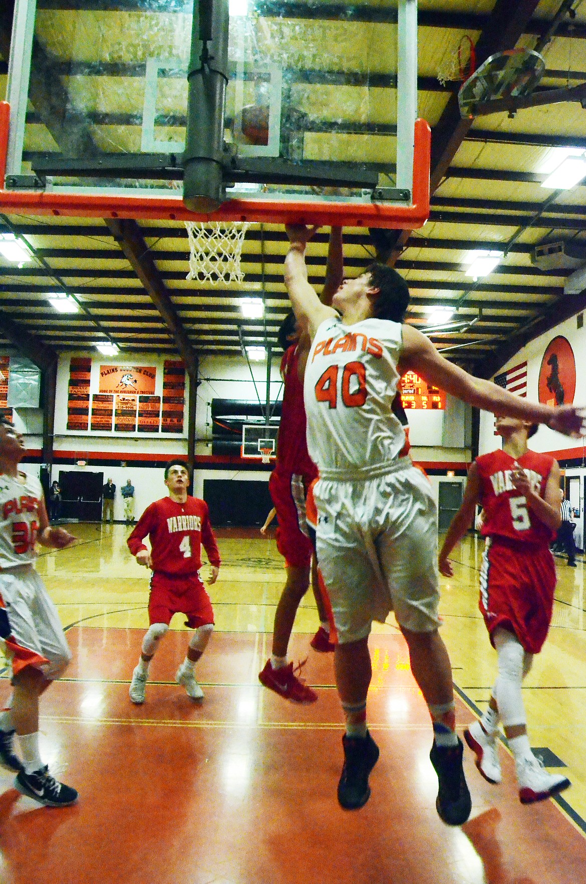 Jay Vonheeder (40) slays a lay-up through a tough Warrior defense (Erin Jusseaume/ Clark Fork Valley Press)