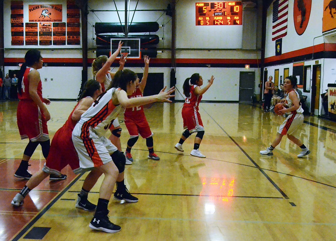 Haley Josephson looks for an opening to pass (Erin Jusseaume/ Clark Fork Valley Press)