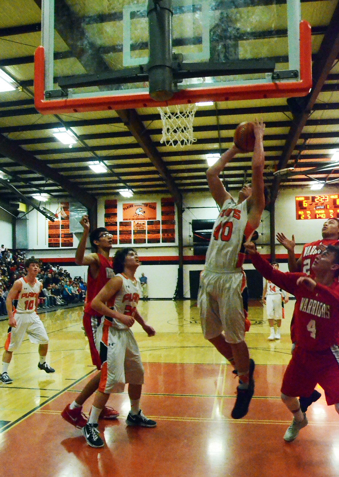 Jay Vonheeder (40) fights back in the first period to make a basket against a strong Arlee Warriors side (Erin Jusseaume/ Clark Fork Valley Press)