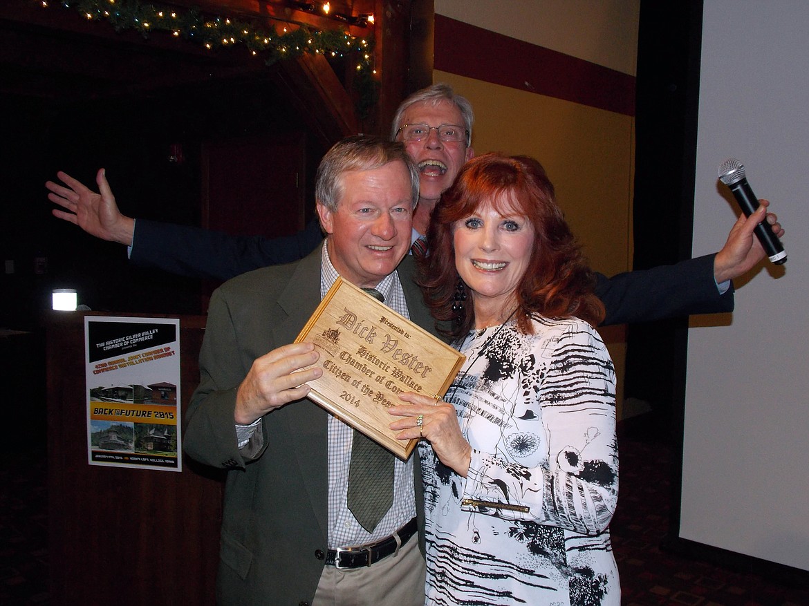 Photo by KERI ALEXANDER
Mayor Dick Vester received the 2014 Citizen of the Year award from the Wallace Chamber of Commerce. Bonnie DeRoos (pictured on the right) presented the award to Dick at Noah&#146;s Loft in Kellogg during the joint Chamber of Commerce Gala in January 2015. Also pictured with them is the late, great Vern Hanson who photobombed the picture while MC-ing the event.