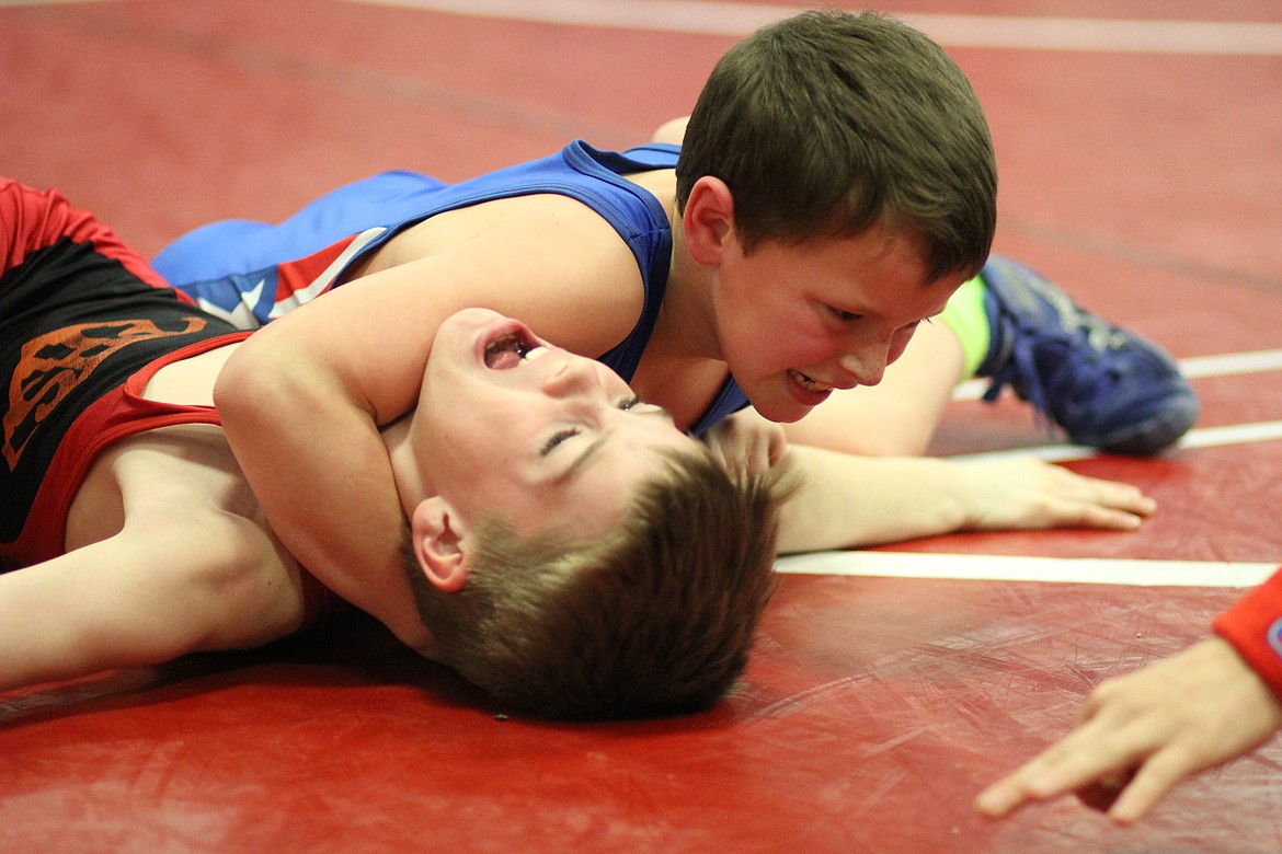 Little Guy Wrestlers Hit the Mats as Tourneys Begin, Mar. 15: Clark Fork wrestler Wade Calloway beat Plains wrestler Johnny Waterbury for third place in 70 lb. Unit 3 Novice. (Kathleen Woodford/Mineral Independent).