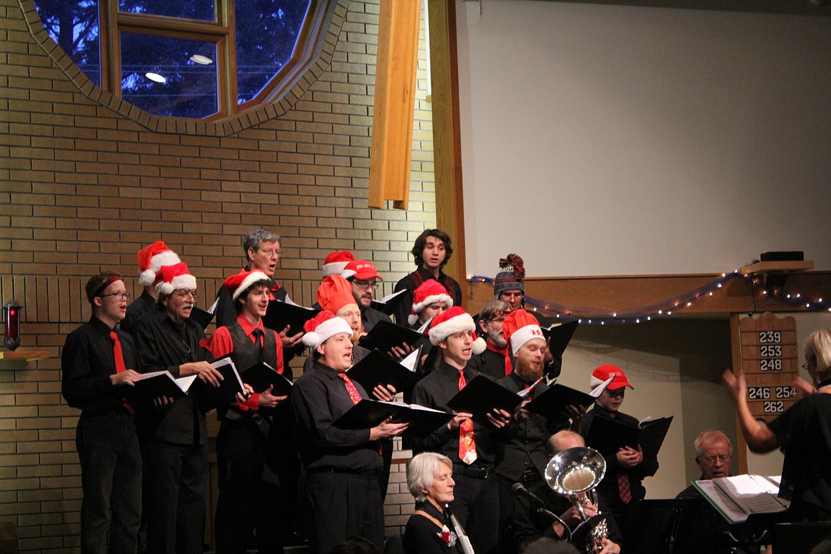 Photo by Tanna Yeoumans
The men came together to sing merrily before throwing their Santa hats in the air.