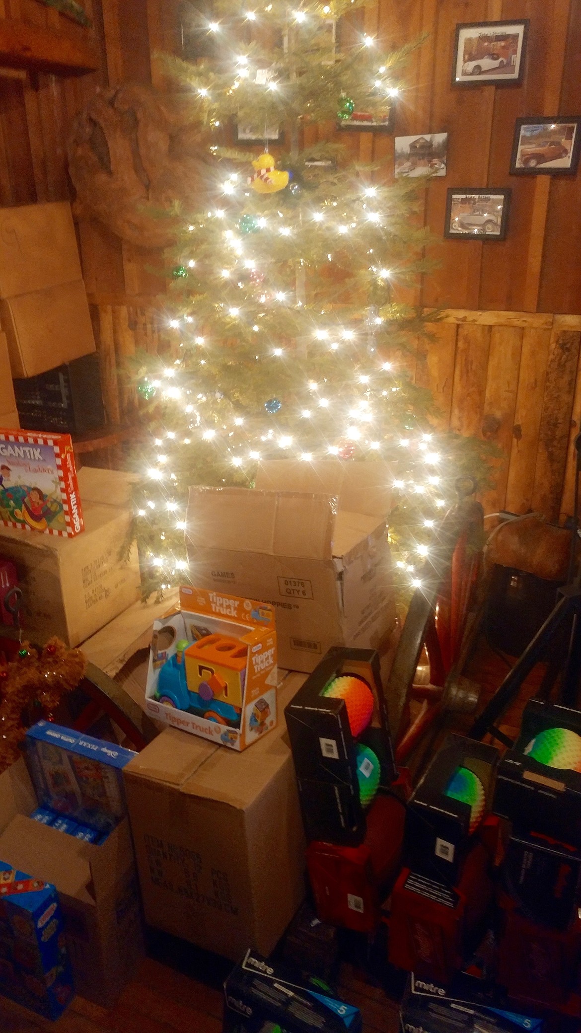 The Christmas tree with all of the donated presents around it. Santa gave away several hundred toys at the event.