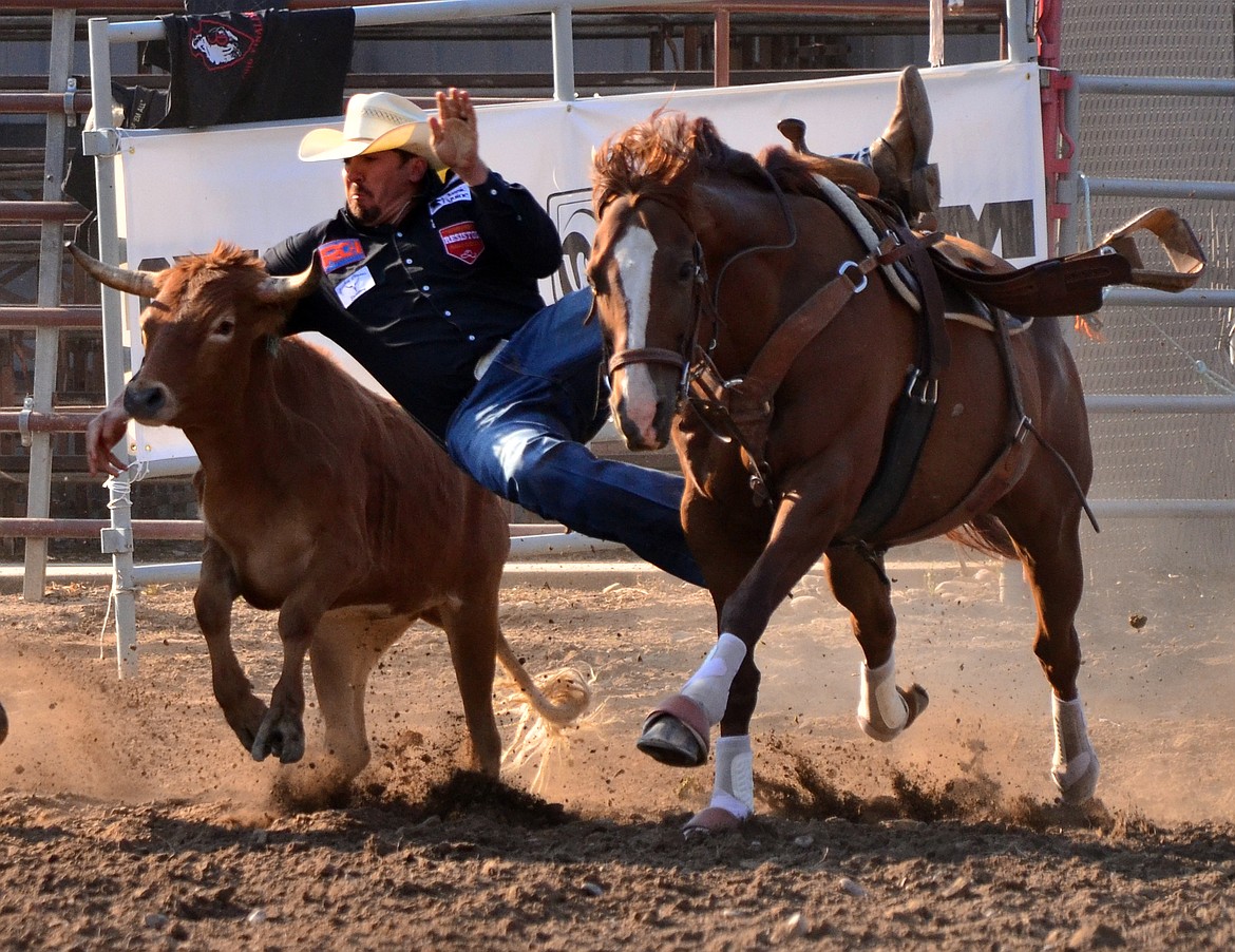 Newly crowned 2017 World Champion Steer Wrestler Tyler Pearson puts one down in Plains to tie for fourth place. (Erin Jusseaume/ Clark Fork Valley Press)