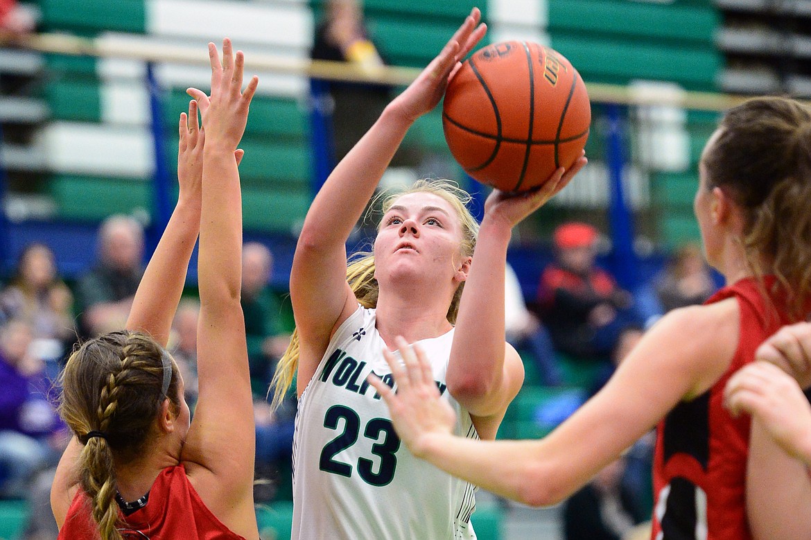 Glacier's Anna Schrade looks to shoot with Bozeman's Ashlyn Lewis (11) defending. (Casey Kreider/Daily Inter Lake)