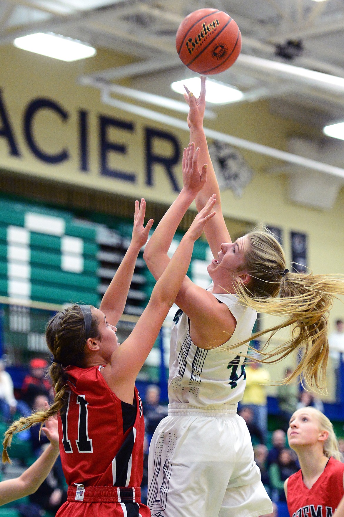 Glacier's Aubrie Rademacher shoots over Bozeman's Ashlyn Lewis. (Casey Kreider/Daily Inter Lake)