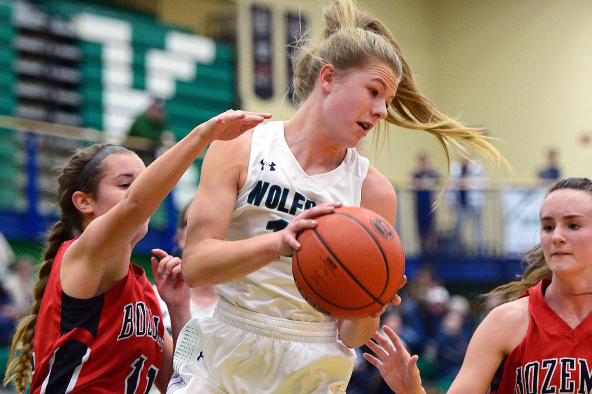 Glacier's Aubrie Rademacher comes down with a second-quarter rebound against Bozeman. (Casey Kreider/Daily Inter Lake)