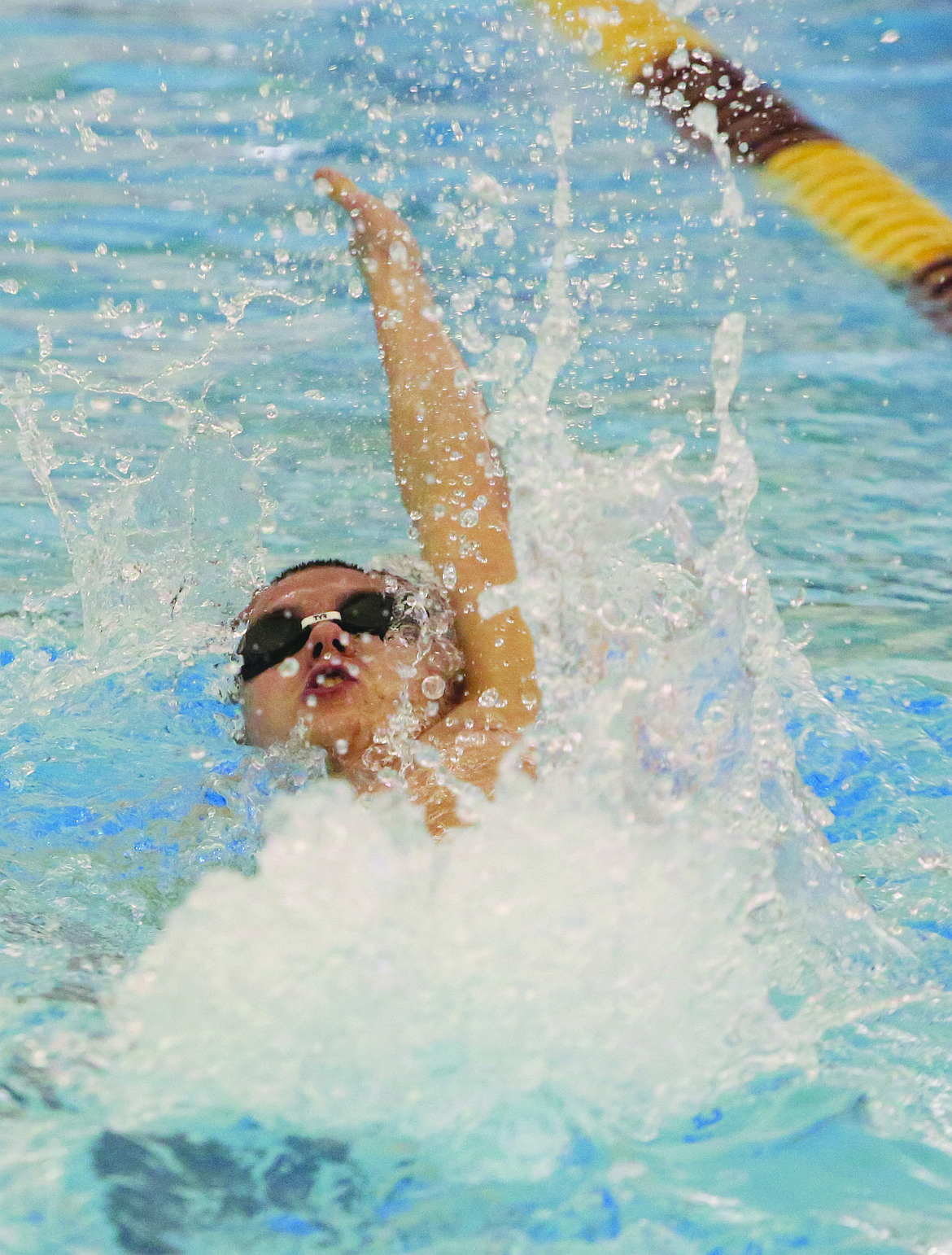 Connor Vanderweyst/Columbia Basin Herald
Moses Lake&#146;s Eric Kemper swims the 100 backstroke. Kemper won the event.