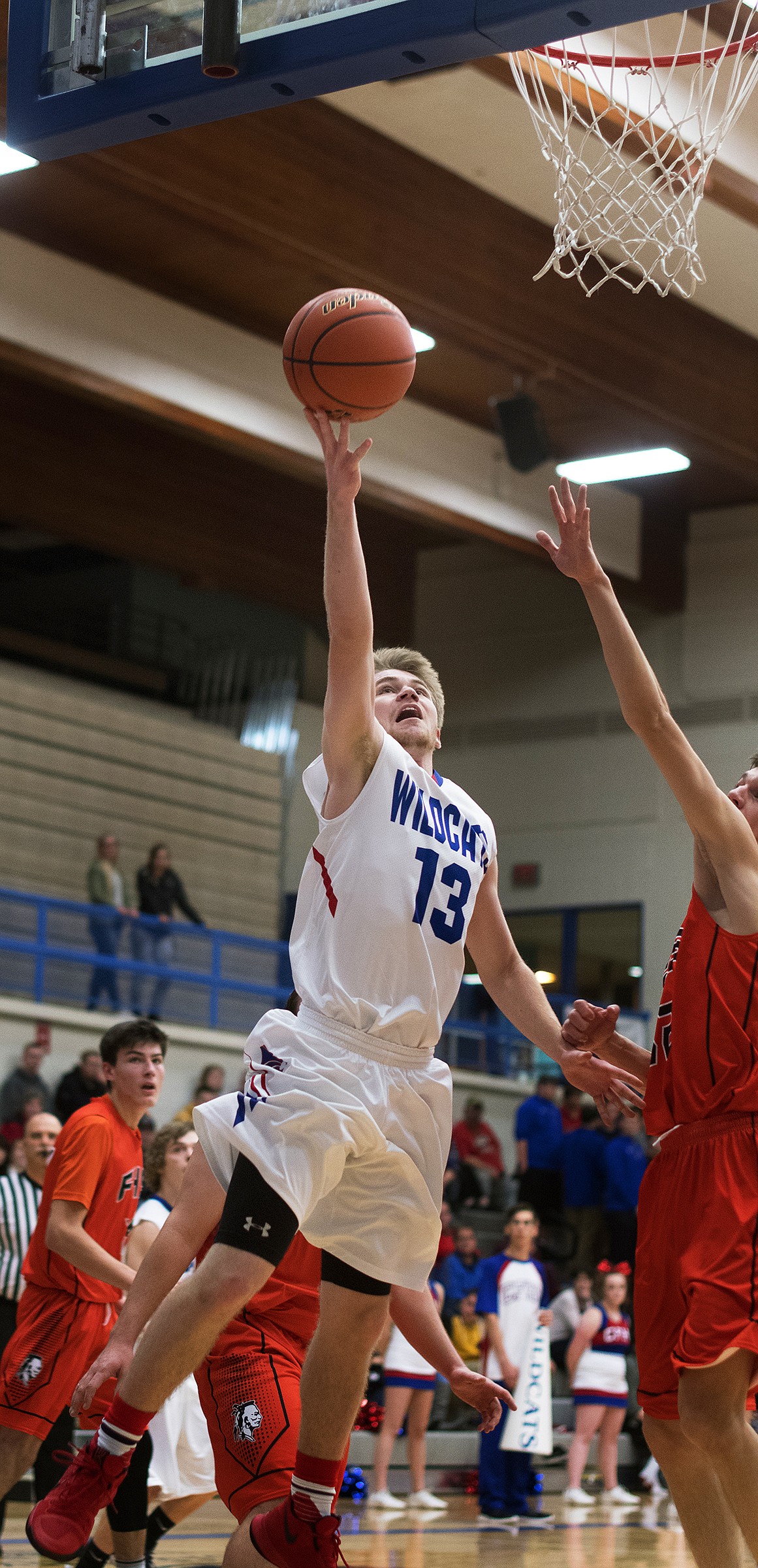 L.J. Panasuk goes up for two of his 12 points against Flathead Saturday. (Jeremy Weber photo)