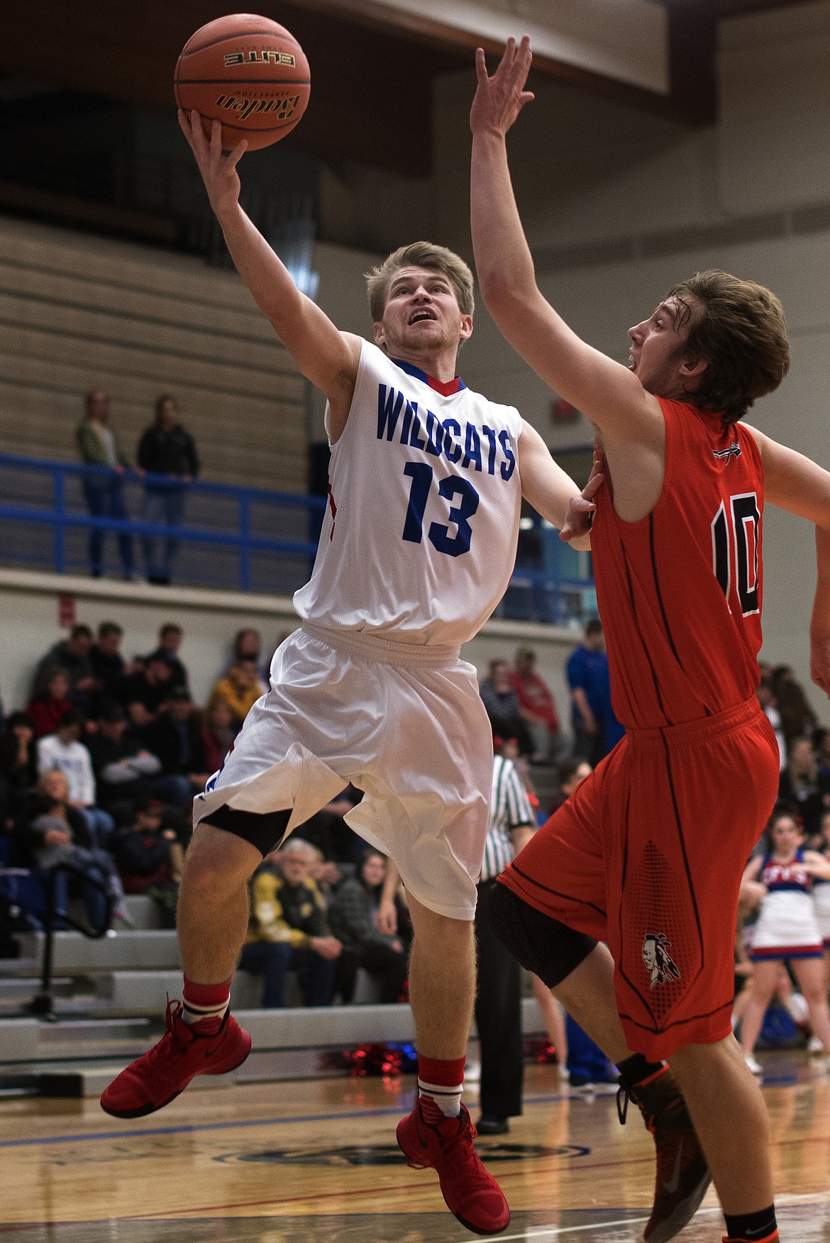 L.J. Panasuk goes in for a layup against Flathead. (Jeremy Weber photo)