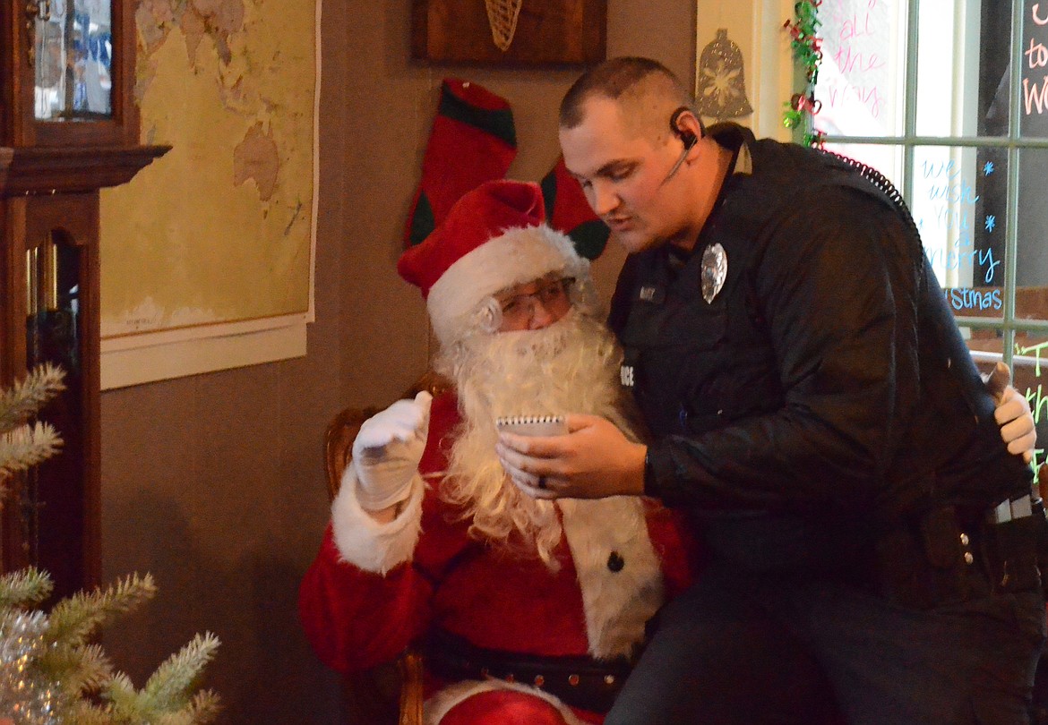 Plains Police Department Officer Ethan Hawke with Santa.