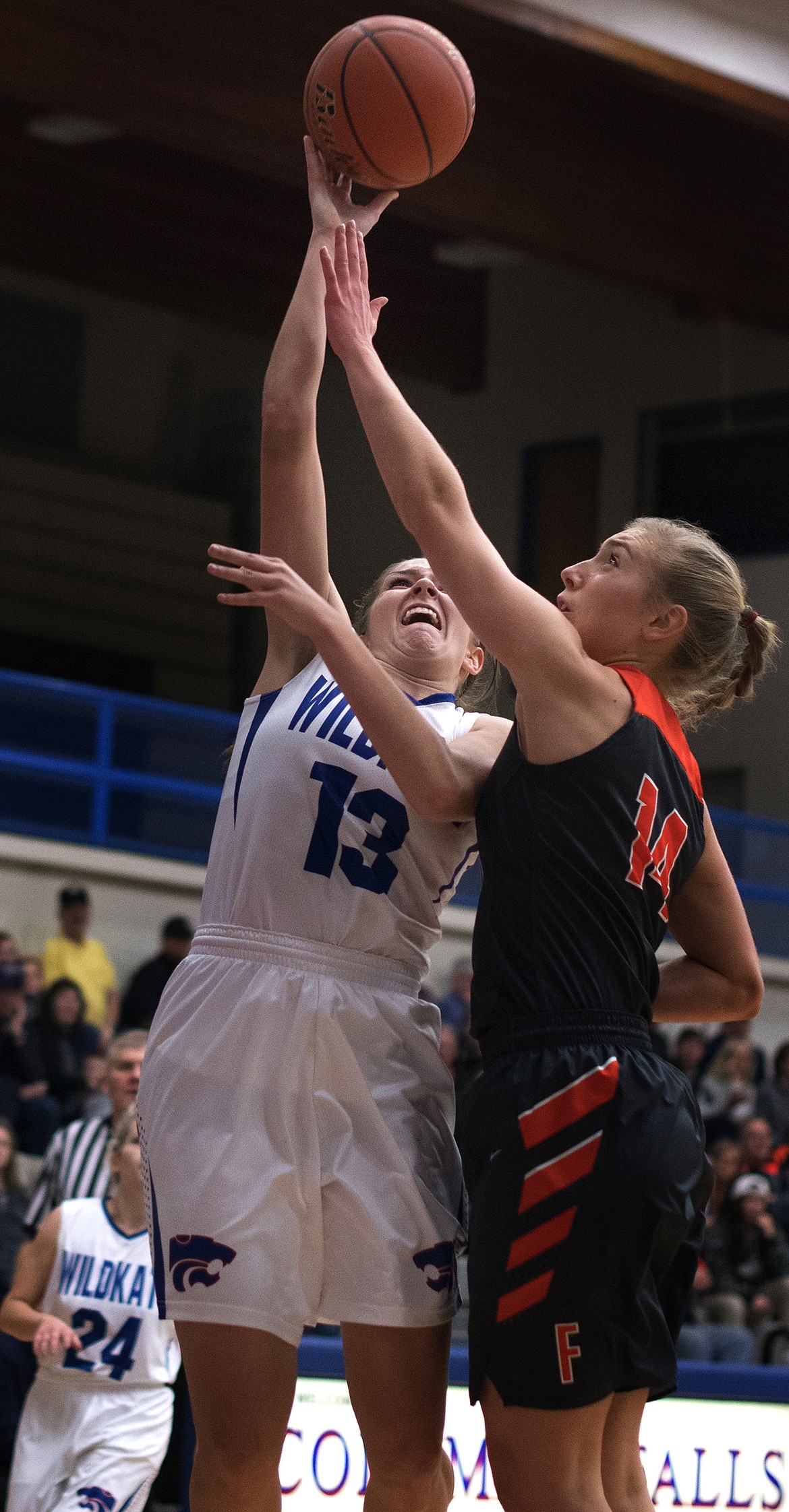 Hannah Gedlaman goes up for a tough shot over a Flathead defender. (Jeremy Weber photo)