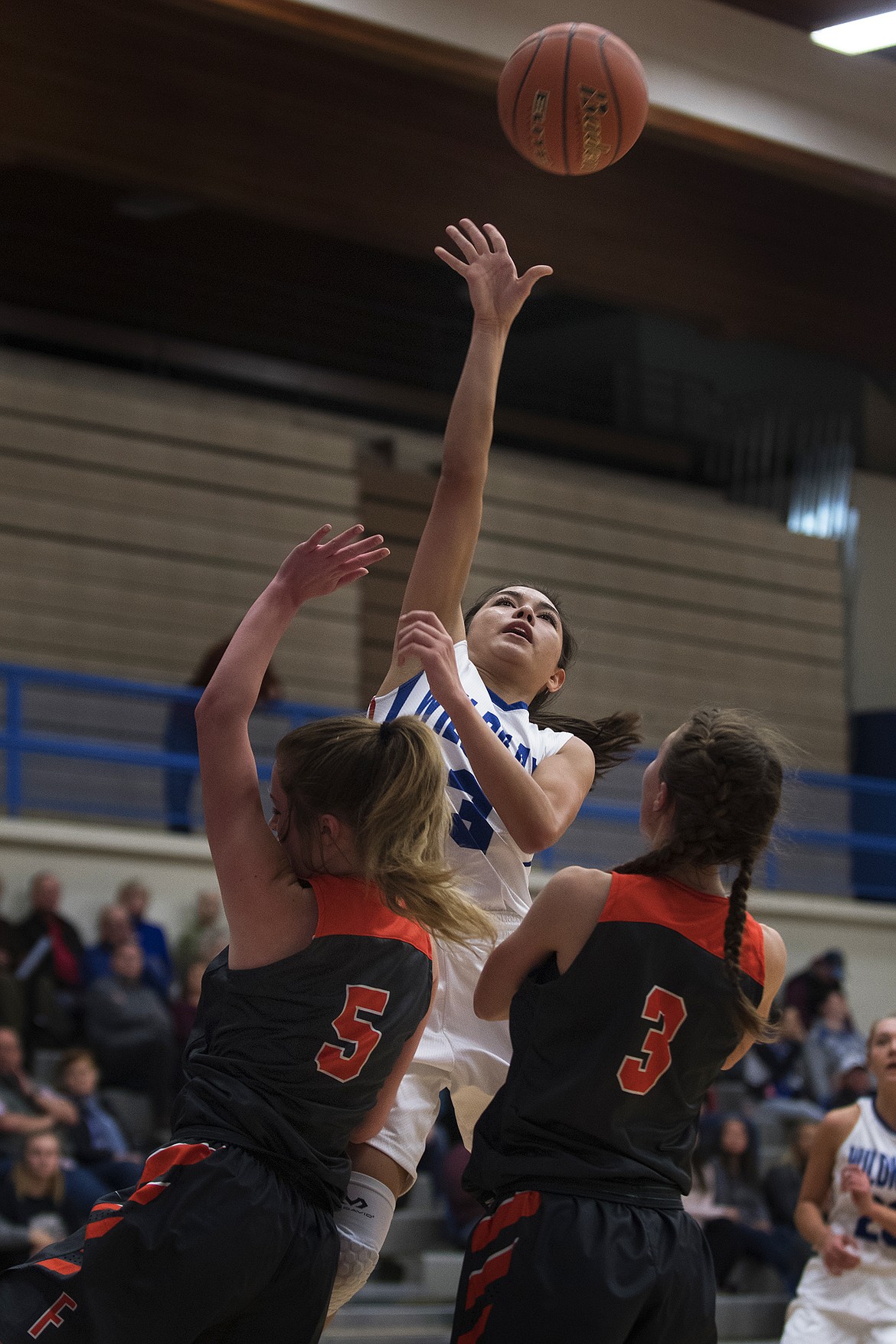 Dani Douglas goes up for a runner against Flathead. (Jeremy Weber photo)