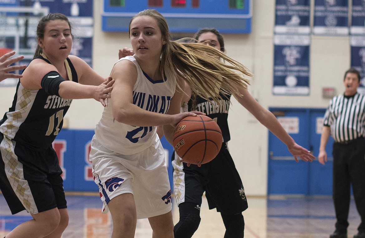 Peyton Rhodes looks to pass against Stevensville. (Jeremy Weber photo)