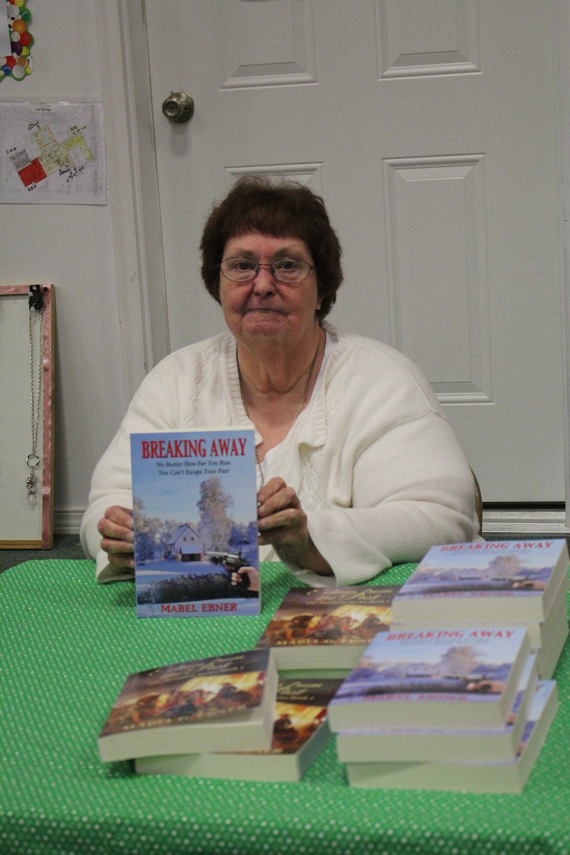 Superior author Mabel Ebner, 71, has her most recent book, &#147;Breaking Away,&#148; available. The new book is a departure from her Montana Series set in Northwest Montana during the mid-1800s. (Kathleen Woodford/Mineral Independent)