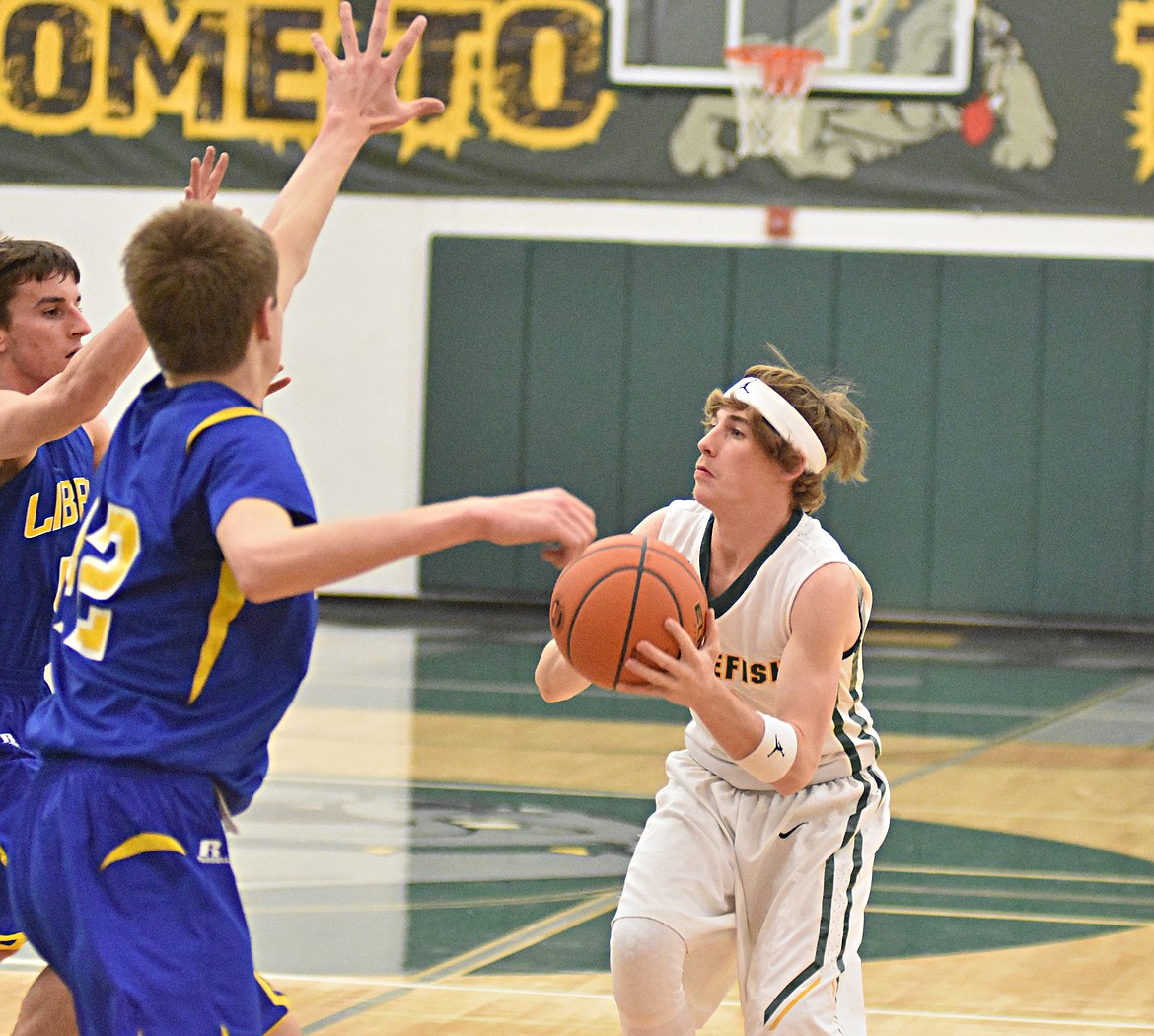 Bulldog senior Caleb Meehan goes up for a shot during Thursday&#146;s game against Libby at Whitefish High School. (Heidi Desch/Whitefish Pilot)