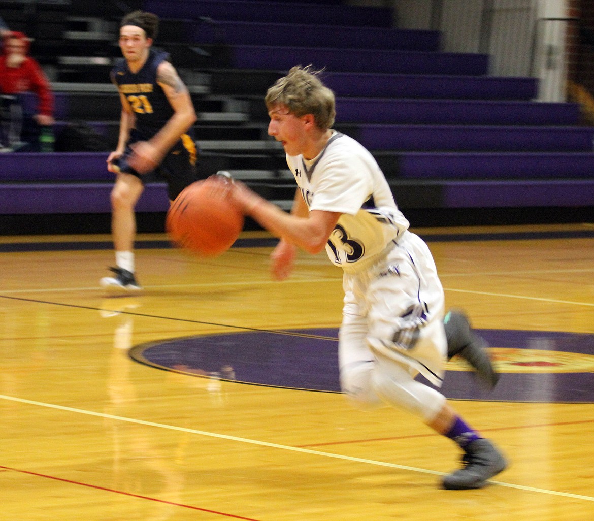 Photo by Josh McDonald
Mullan&#146;s Caden Crandall pushes the ball in transition during a recent game with Genesis Prep.