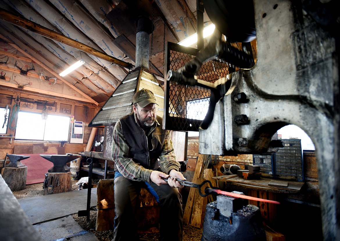 Andreas Hornsteiner working in Rebel Mountain Forge on Tuesday, December 12, in Trego.(Brenda Ahearn/Daily Inter Lake)