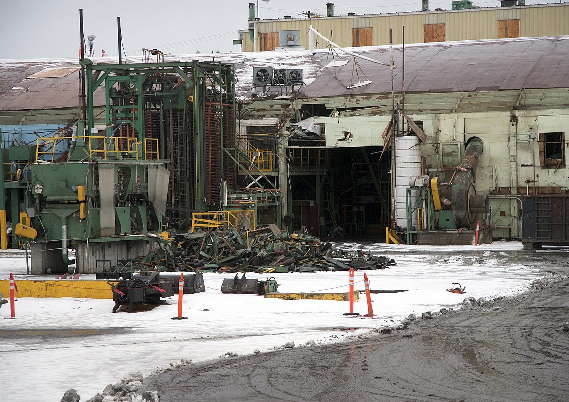 Demolition work continues at the former Weyerhaeuser plywood warehouse facility in Columbia Falls. (Jeremy Weber photo)