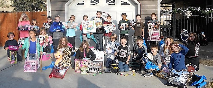 Mrs. Crabb&#146;s fourth-grade class in Superior raised money to buy Christmas presents for local children. They gave the gifts to the Women in Timber group to put into family baskets which were delivered throughout Mineral County. (Photos courtesy of Stacy Crabb)