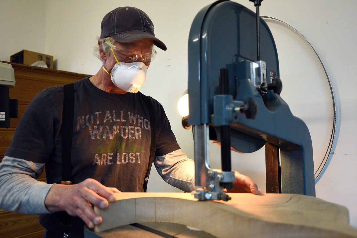 Brent Champion uses a bandsaw to work on Guitar Shoes at his workshop on Wednesday, Nov. 29.