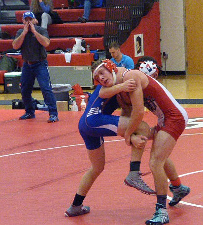 ARLEE WRESTLER Skylar Titsworth fights for position against a Mission wrestler at the Arlee Mixer Thursday nigh at Arlee High School. (Photo by Deanne Smith/Special to the Lake County Leader)