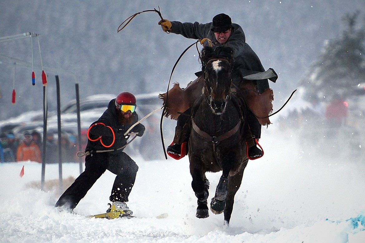 A horse and rider pulls a skier through the skijoring course at Rebecca Farm on Saturday, Dec. 30. (Casey Kreider/Daily Inter Lake)