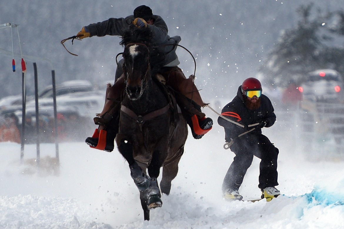 A horse and rider pulls a skier through the skijoring course at Rebecca Farm on Saturday, Dec. 30. (Casey Kreider/Daily Inter Lake)