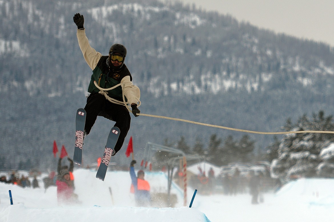 A horse and rider pulls a skier through the skijoring course at Rebecca Farm on Saturday, Dec. 30. (Casey Kreider/Daily Inter Lake)