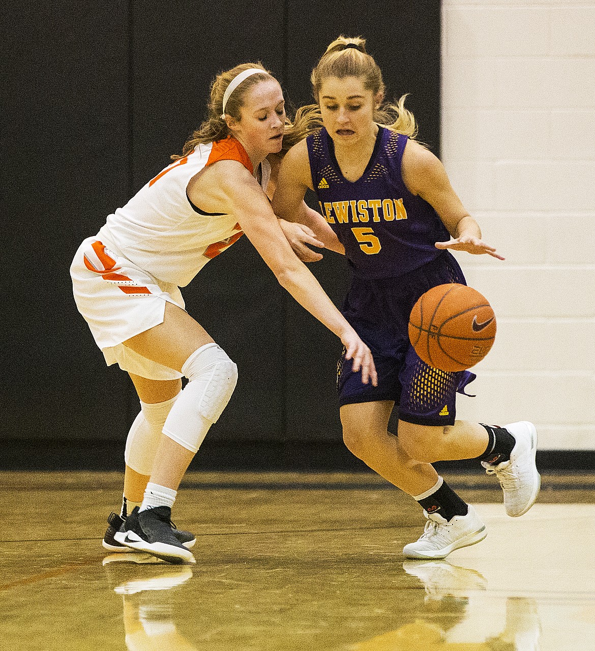 Tyler McCliment-Call, left, of Post Falls tries to steal the ball from Lewiston&#146;s Bryn Cornelia.