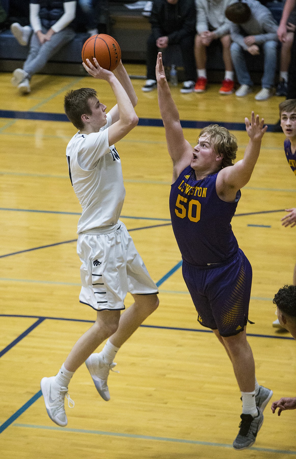 James Carlson of Lake City goes up for a shot over Lewiston&#146;s Kyle Van Boeyen.