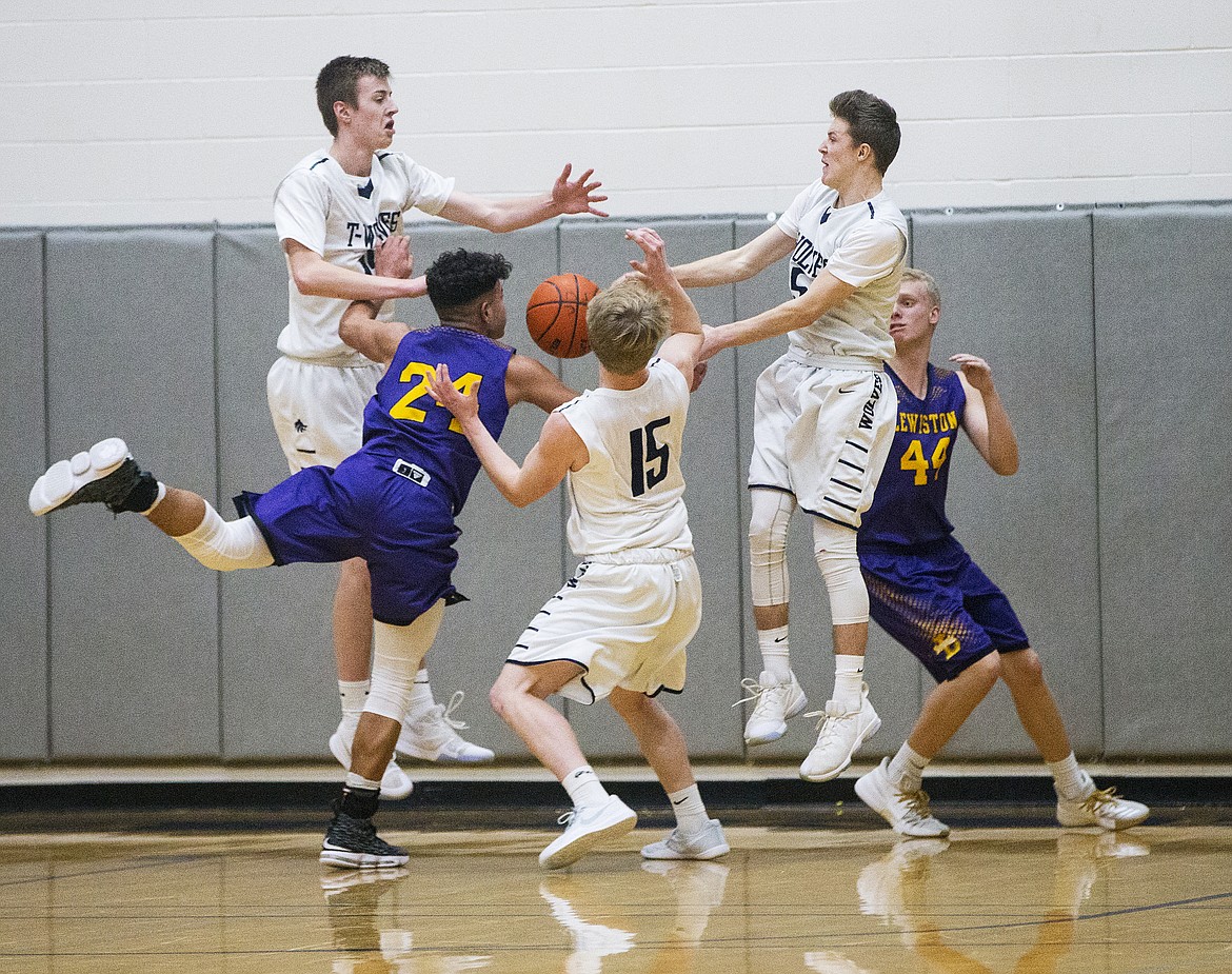 Players from Lewiston and Lake City battle for a rebound.