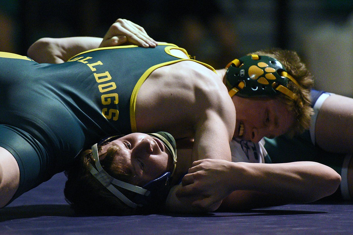 Whitefish&#146;s Nathan Sproul, top, works toward a pin of Glacier&#146;s Kael Willis at 113 pounds. (Casey Kreider/Daily Inter Lake)