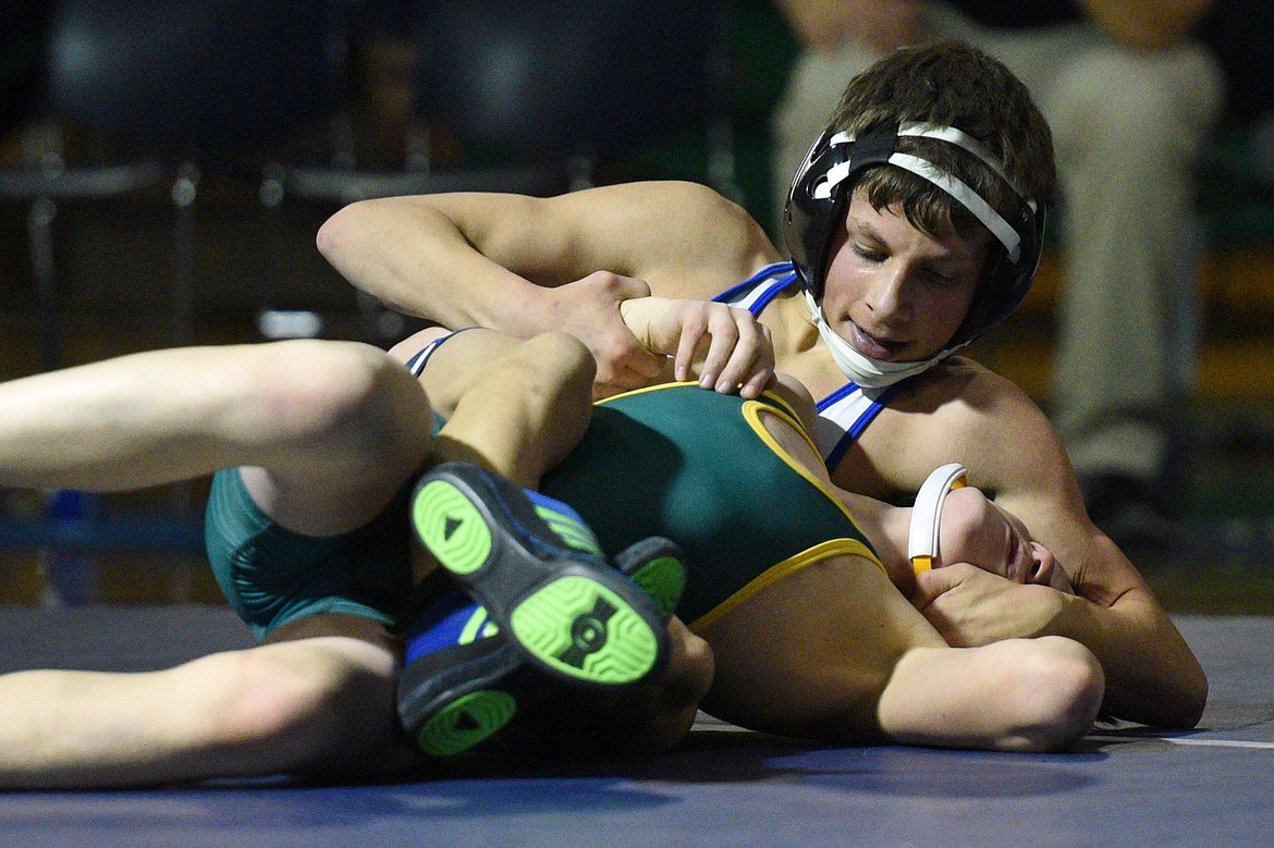 Glacier&#146;s Dylan Miller, top, won by decision over Whitefish&#146;s Jackson Carson at 103 pounds. (Casey Kreider/Daily Inter Lake)