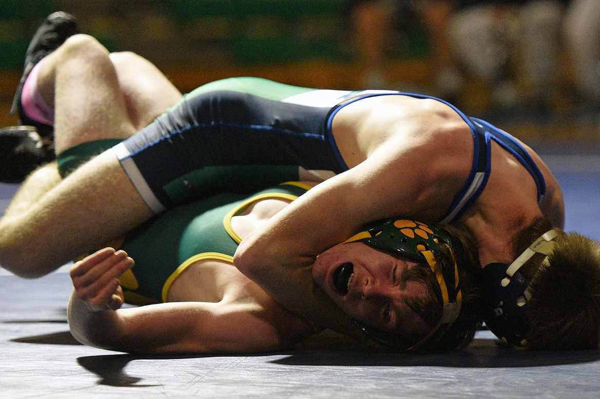 Glacier&#146;s Tristan Little, top, wrestles Whitefish&#146;s Nathan Buckley at 120 pounds. Buckley won by pin. (Casey Kreider/Daily Inter Lake)