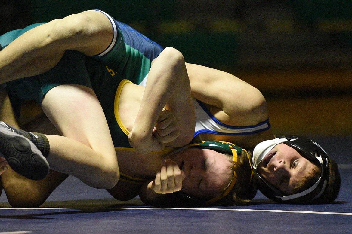 Glacier&#146;s Dylan Miller, top, won by decision over Whitefish&#146;s Jackson Carson at 103 pounds. (Casey Kreider/Daily Inter Lake)