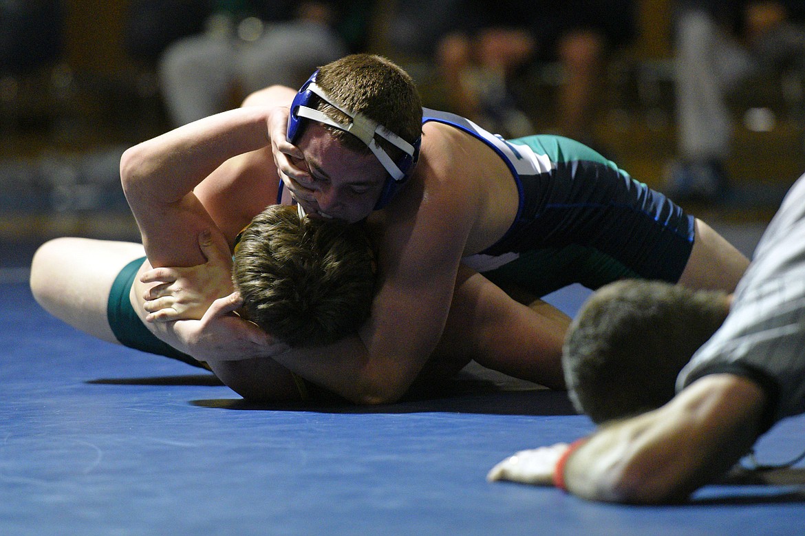 Glacier&#146;s Mason Torrez, top, works toward a pin of Whitefish&#146;s Aalec Pace at 170 pounds. (Casey Kreider/Daily Inter Lake)