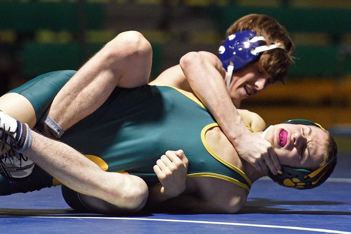 Glacier&#146;s Trey Mitchell, top, won by major decision over Whitefish&#146;s Max Grimes at 138 pounds. (Casey Kreider/Daily Inter Lake)